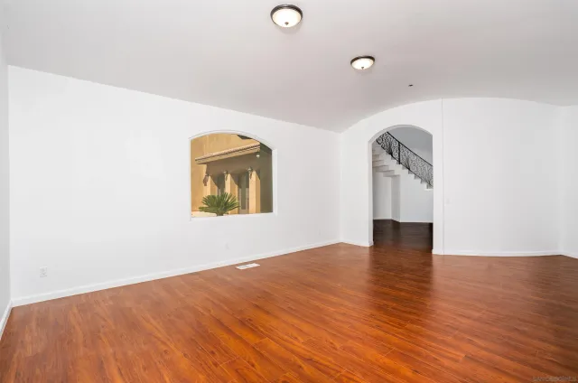a kitchen with a white cabinets and chairs