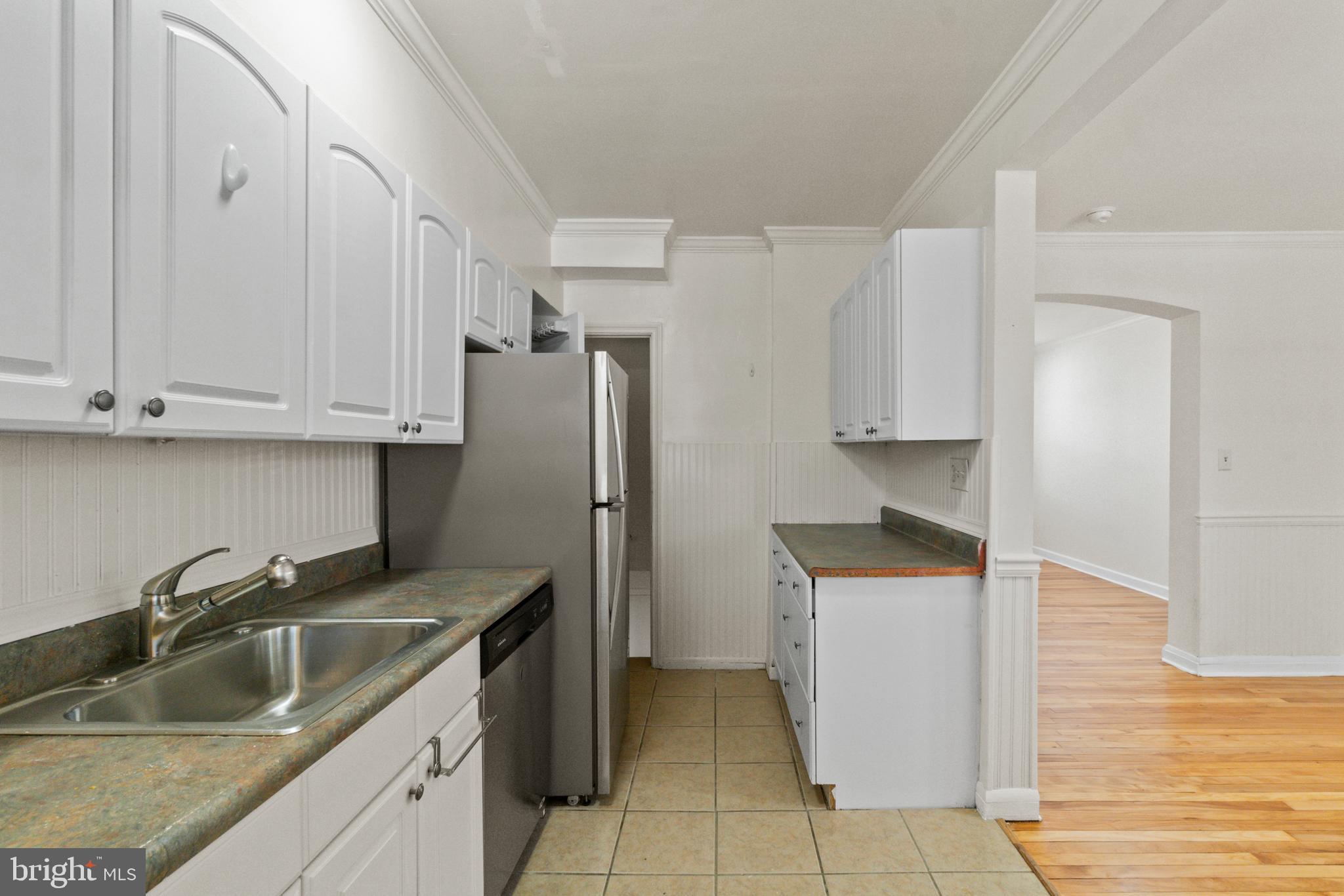 8340 Edgedale Road Baltimore, MD 21234 - Photo 15 of 33 a kitchen with stainless steel appliances granite countertop a sink stove and refrigerator