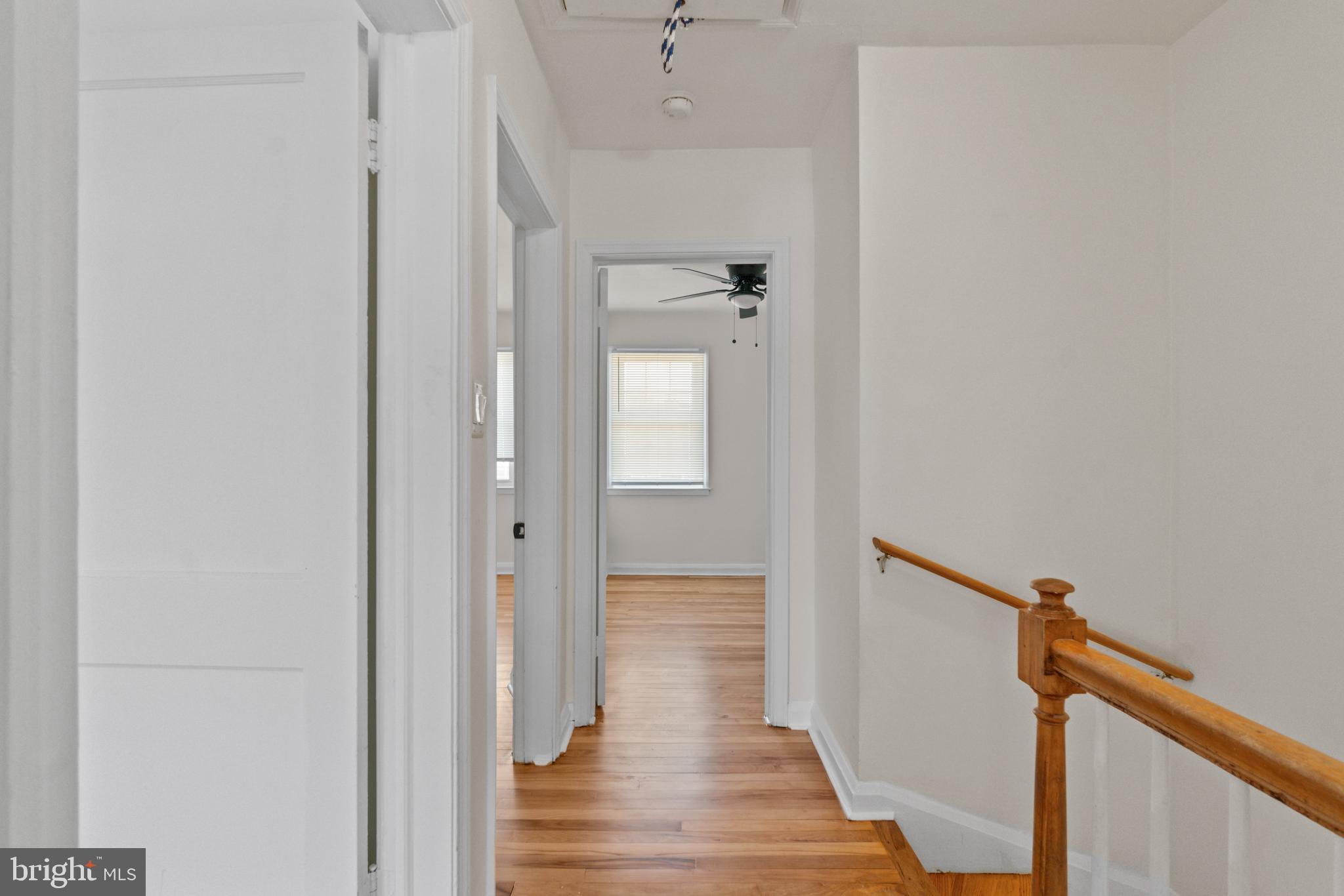 8340 Edgedale Road Baltimore, MD 21234 - Photo 17 of 33 a view of a hallway with wooden floor and staircase