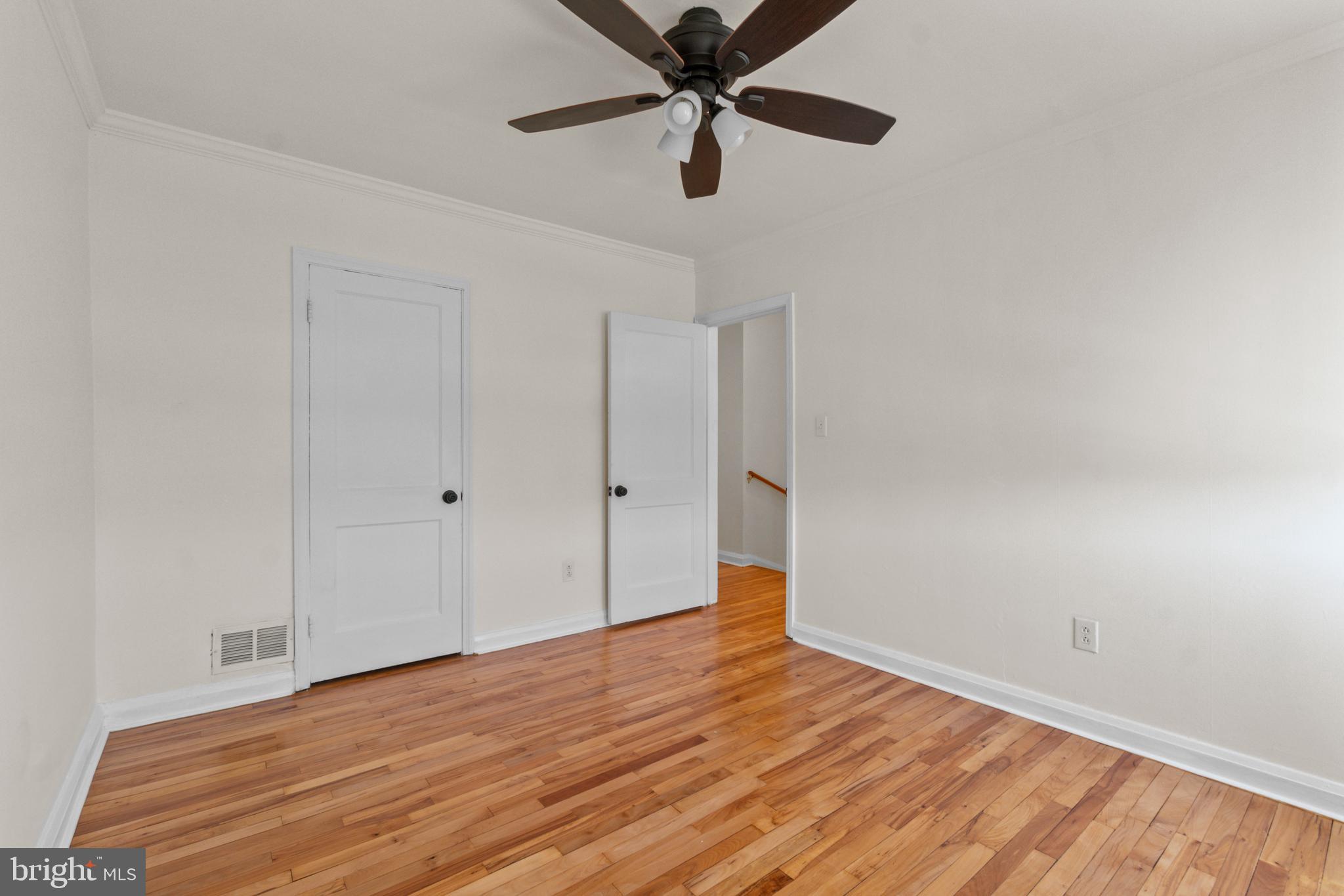 8340 Edgedale Road Baltimore, MD 21234 - Photo 18 of 33 a view of empty room with wooden floor