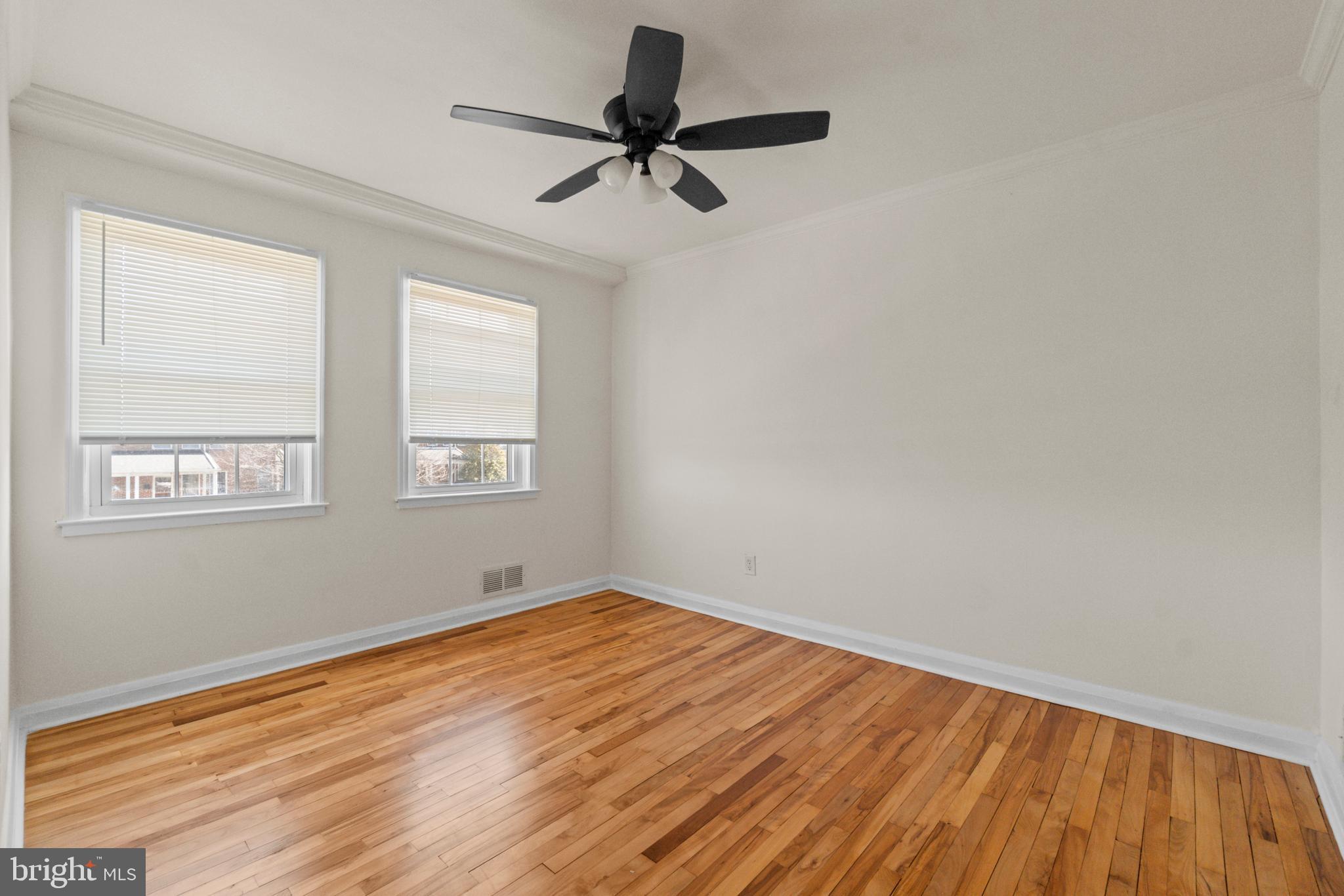8340 Edgedale Road Baltimore, MD 21234 - Photo 19 of 33 a view of empty room with wooden floor and fan