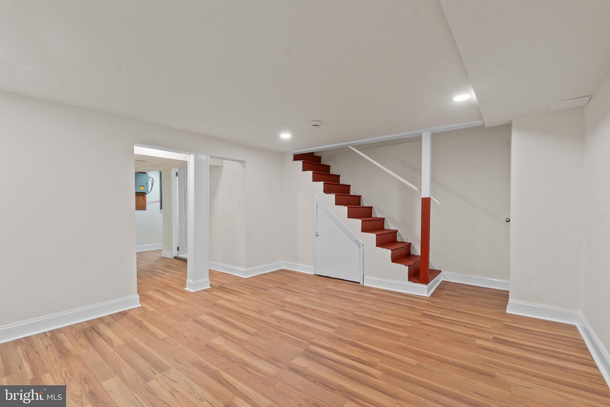 8340 Edgedale Road Baltimore, MD 21234 - Photo 27 of 33 a view of an empty room with wooden floor