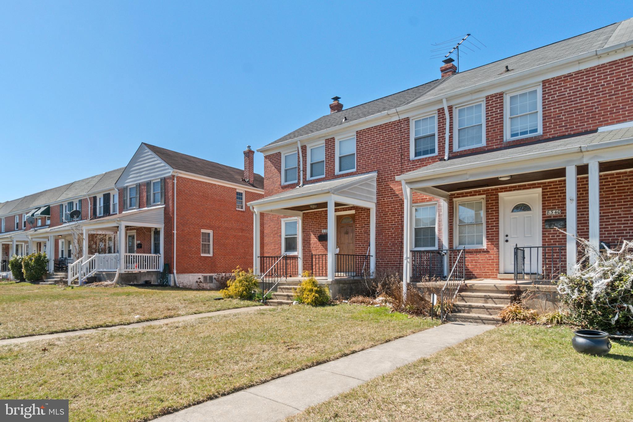 8340 Edgedale Road Baltimore, MD 21234 - Photo 3 of 33 front view of a brick house with a yard