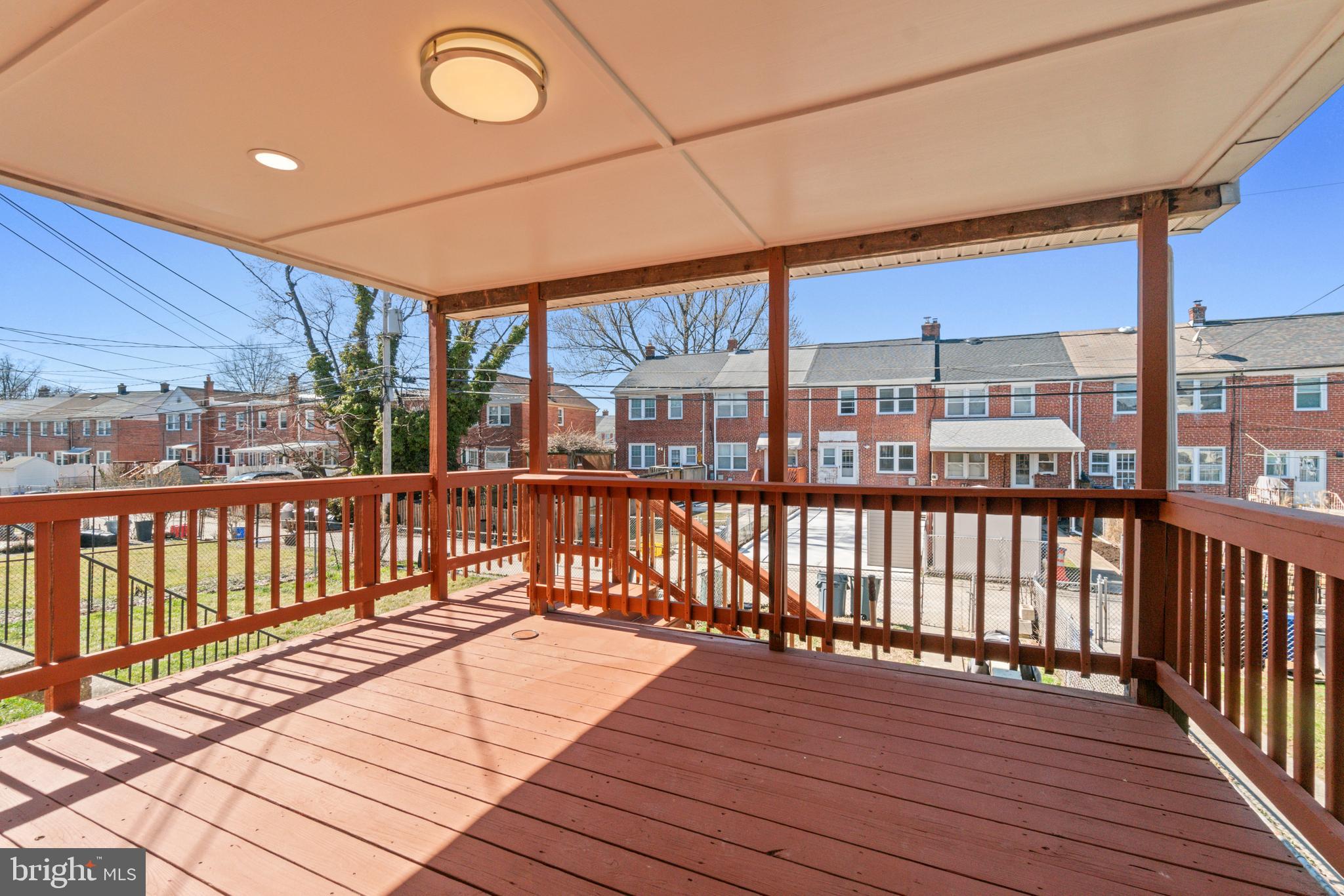 8340 Edgedale Road Baltimore, MD 21234 - Photo 31 of 33 a view of a balcony with wooden floor