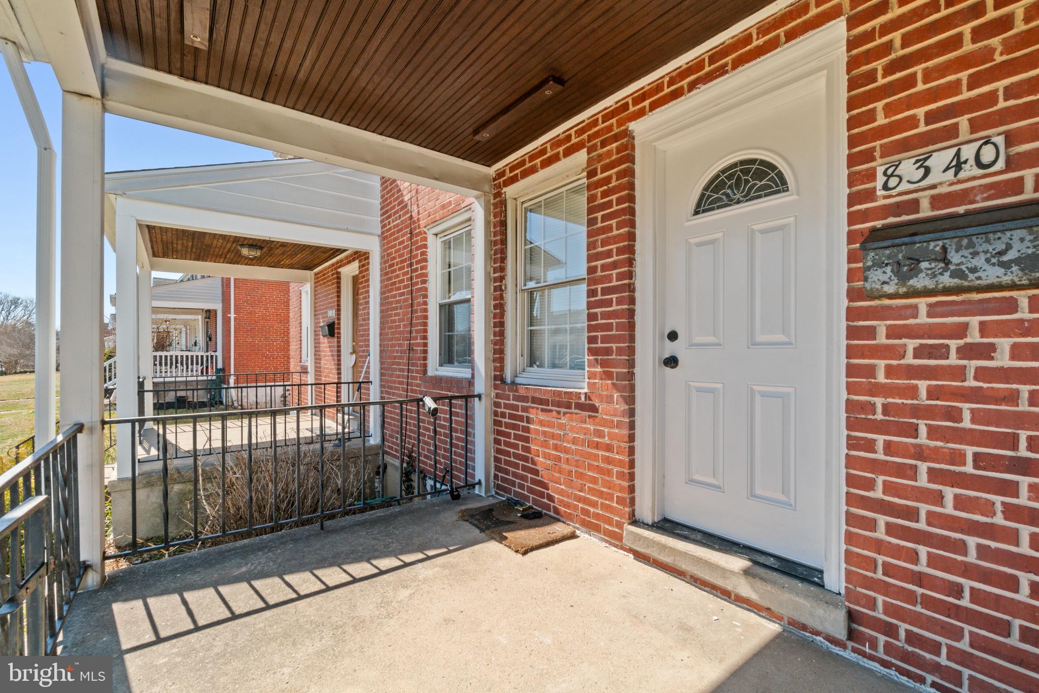 8340 Edgedale Road Baltimore, MD 21234 - Photo 4 of 33 a view of a porch with a door