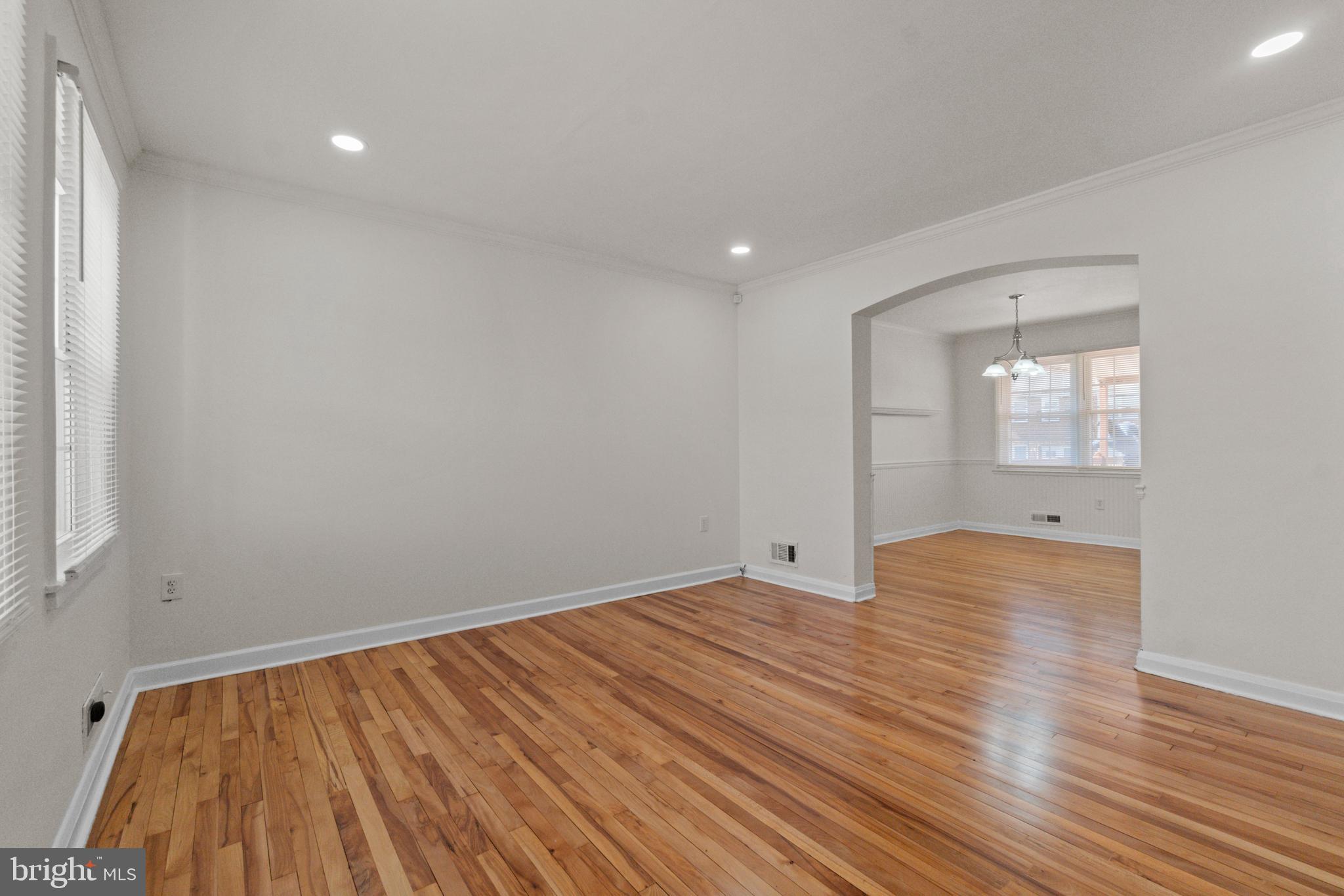 8340 Edgedale Road Baltimore, MD 21234 - Photo 5 of 33 wooden floor in an empty room with a window