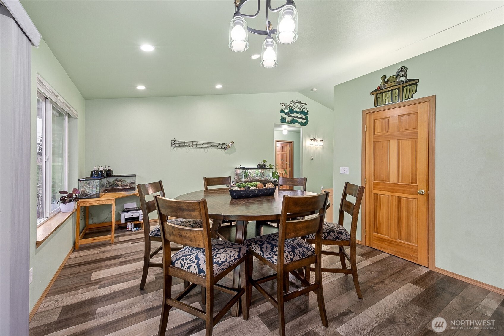 7510 191st Avenue Southwest Rochester, WA 98579 - Photo 11 of 28 a view of a dining room with furniture window and wooden floor