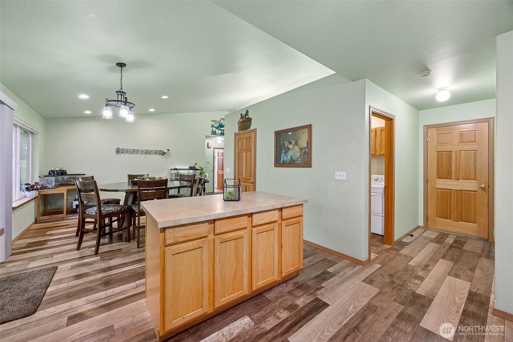 7510 191st Avenue Southwest Rochester, WA 98579 - Photo 13 of 28 a large kitchen with a table and chairs