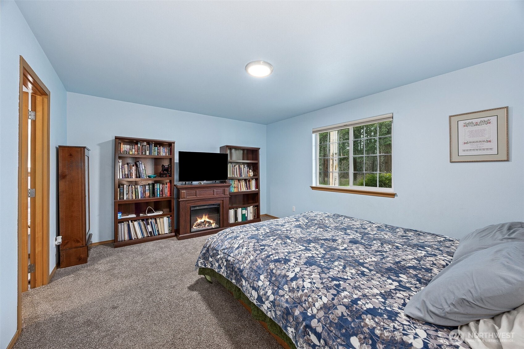 7510 191st Avenue Southwest Rochester, WA 98579 - Photo 15 of 28 a bedroom with a bed and a television in it