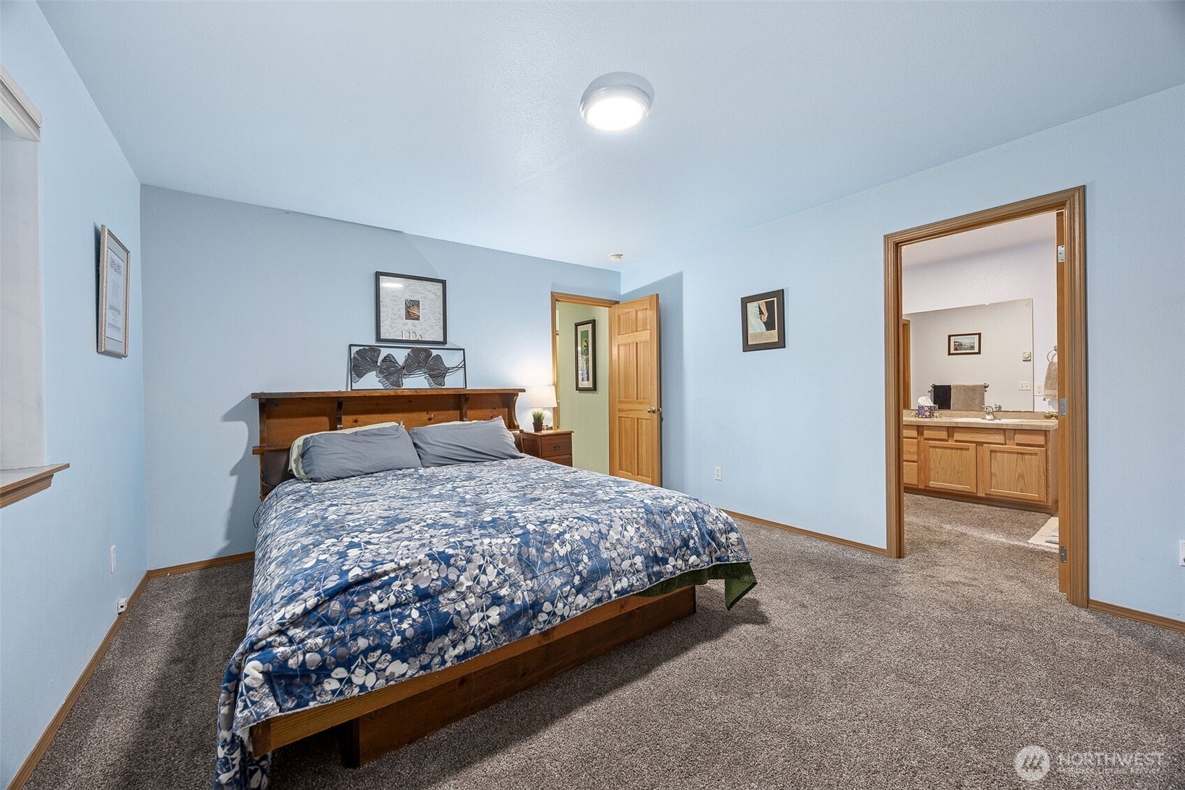 7510 191st Avenue Southwest Rochester, WA 98579 - Photo 16 of 28 a bedroom with a bed and a lamp