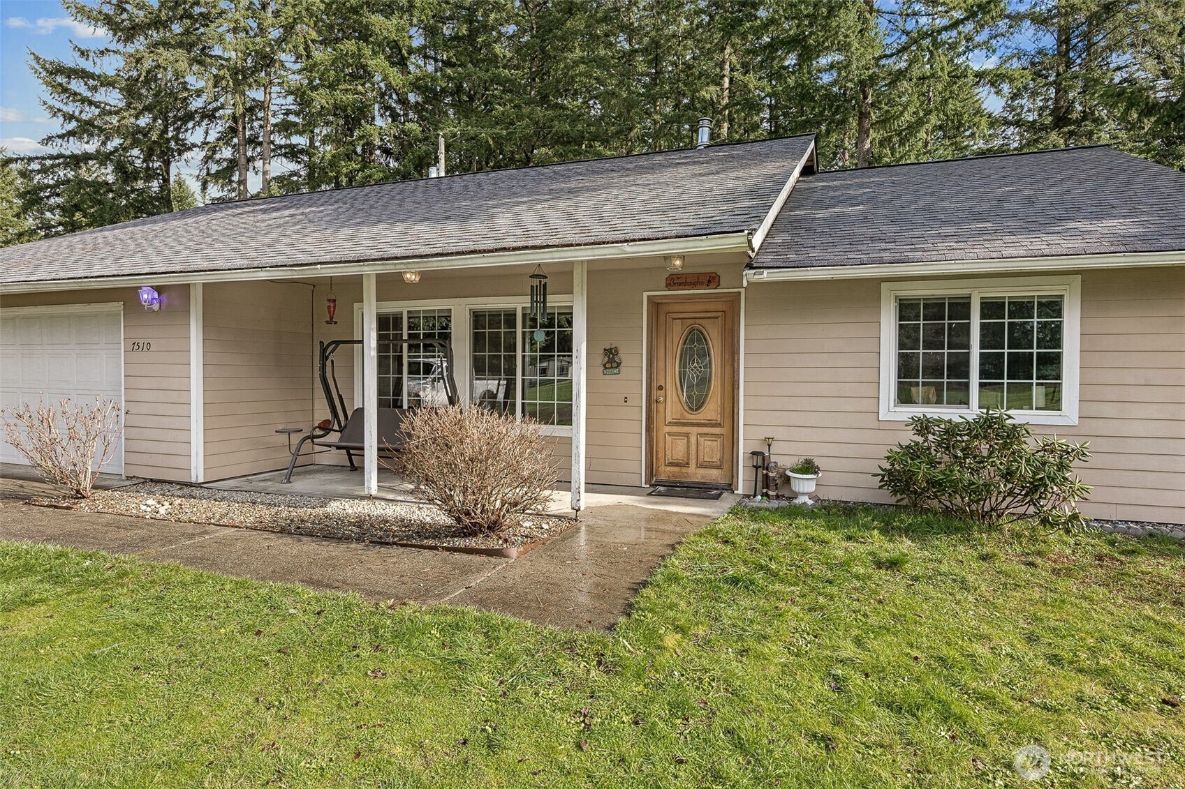 7510 191st Avenue Southwest Rochester, WA 98579 - Photo 2 of 28 front view of a house with a yard