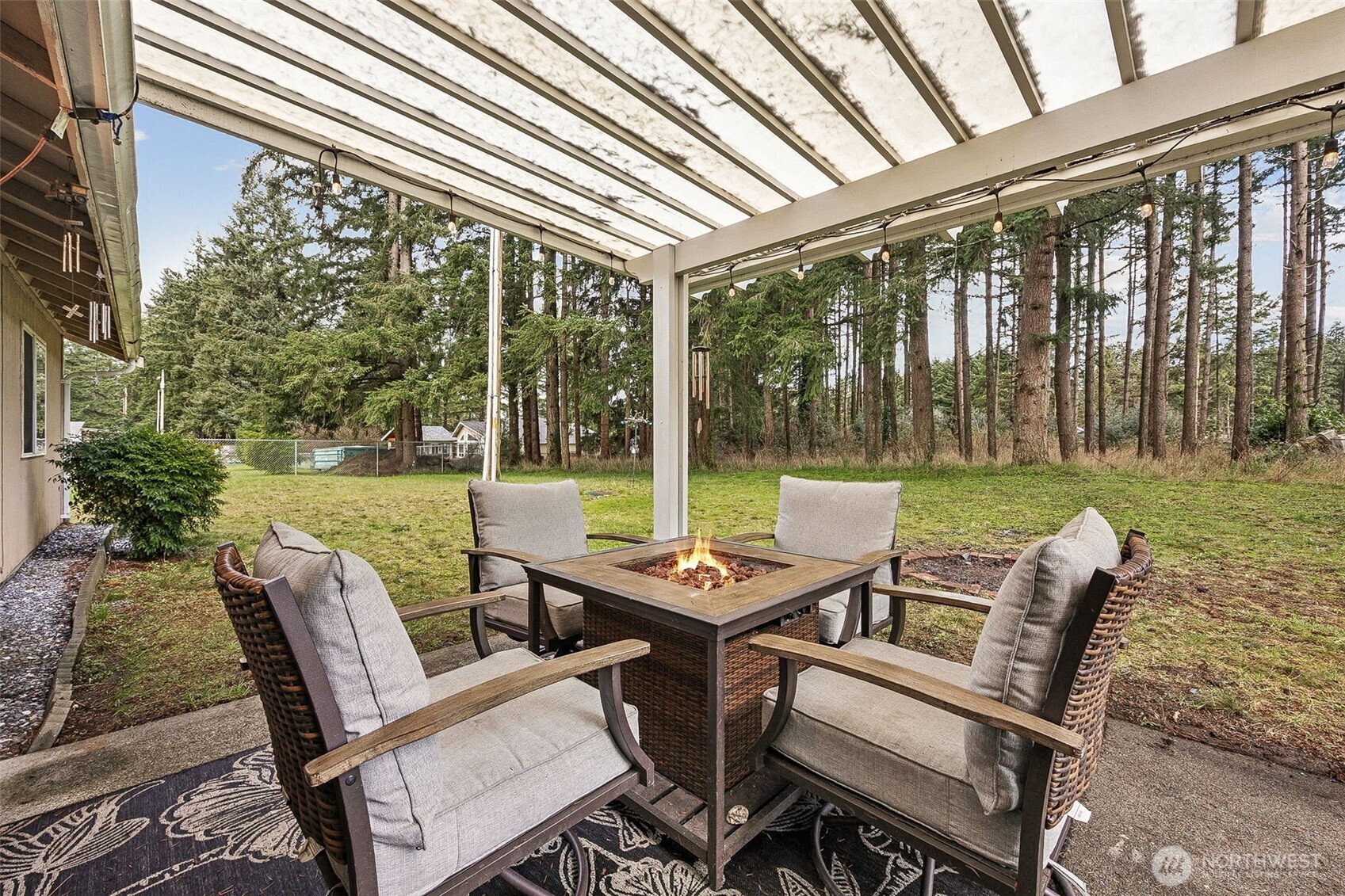 7510 191st Avenue Southwest Rochester, WA 98579 - Photo 21 of 28 a view of a patio with chairs and table in patio