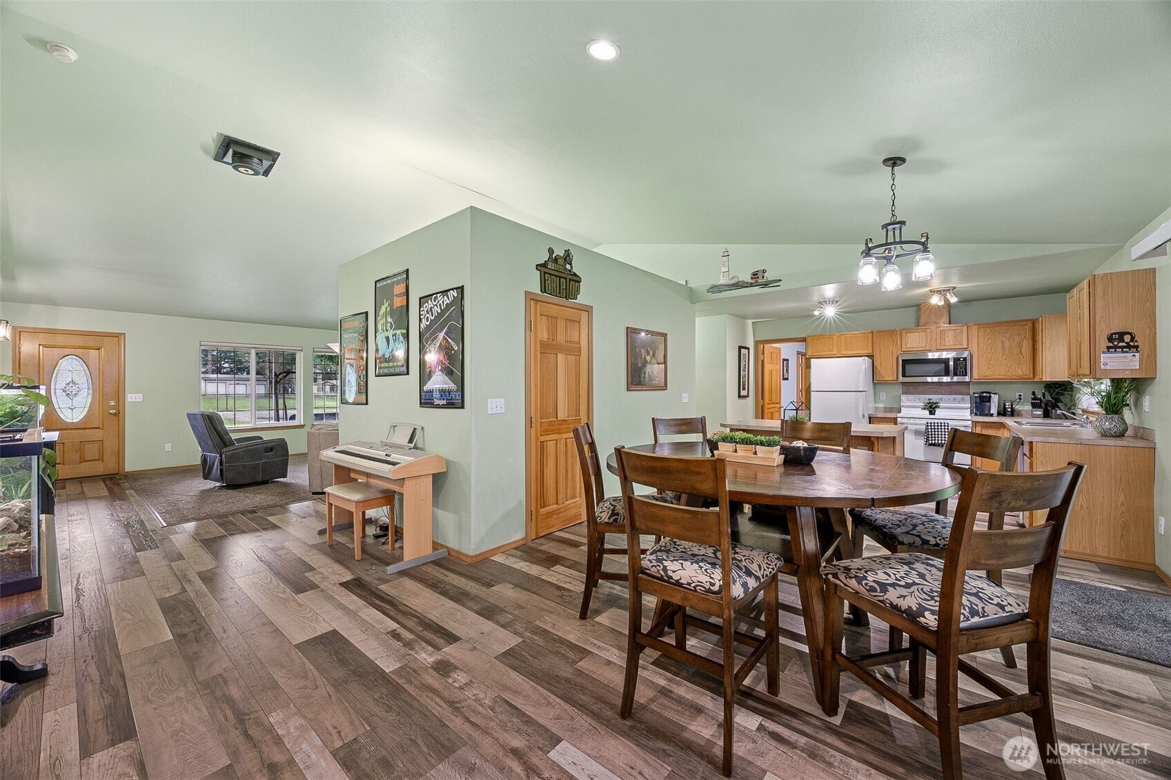 7510 191st Avenue Southwest Rochester, WA 98579 - Photo 9 of 28 a view of a dining room with furniture window and wooden floor