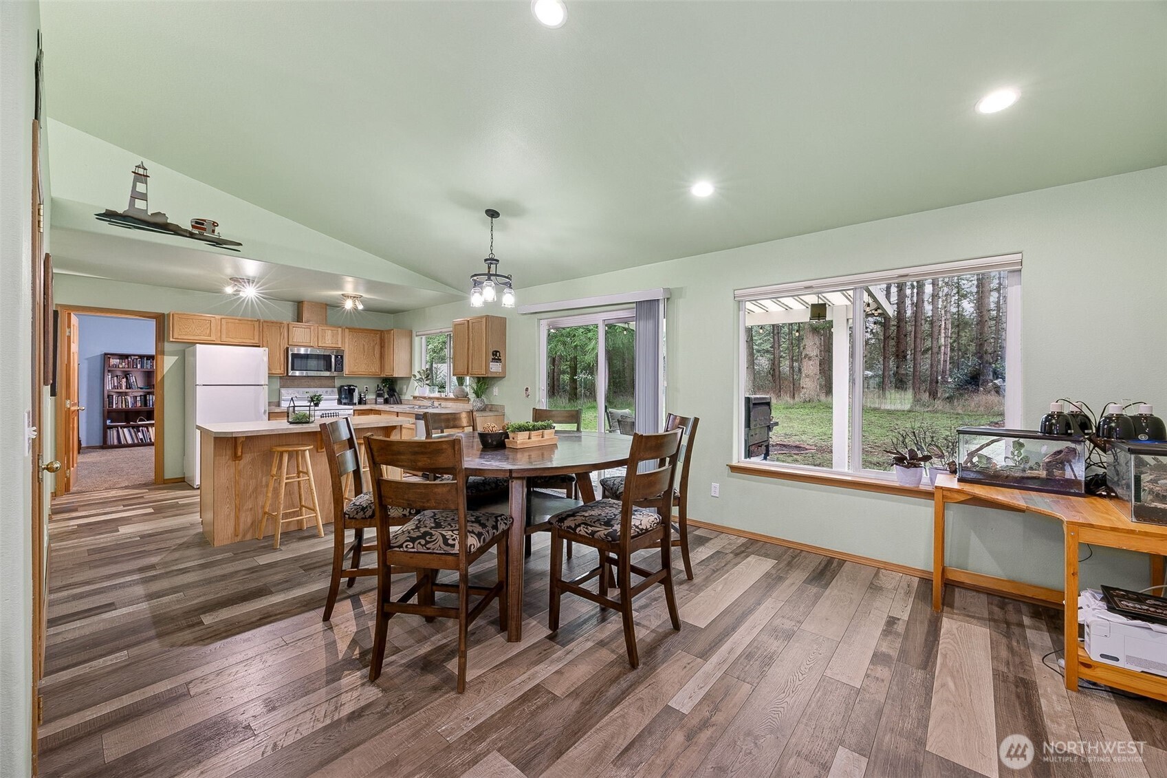 7510 191st Avenue Southwest Rochester, WA 98579 - Photo 10 of 28 a view of a dining room with furniture window and wooden floor