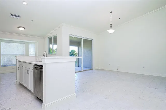 a kitchen with a stove and a sink