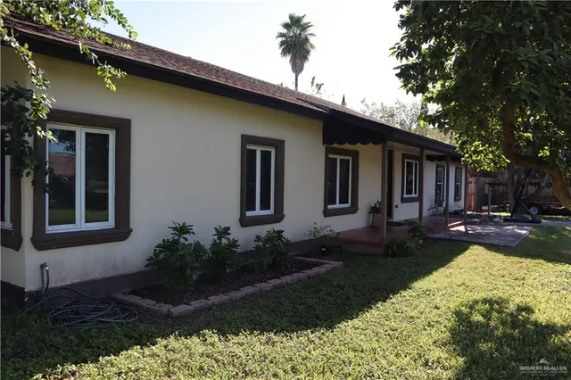 a house view with a garden space