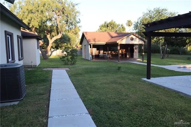 a front view of a house with a yard table and chairs