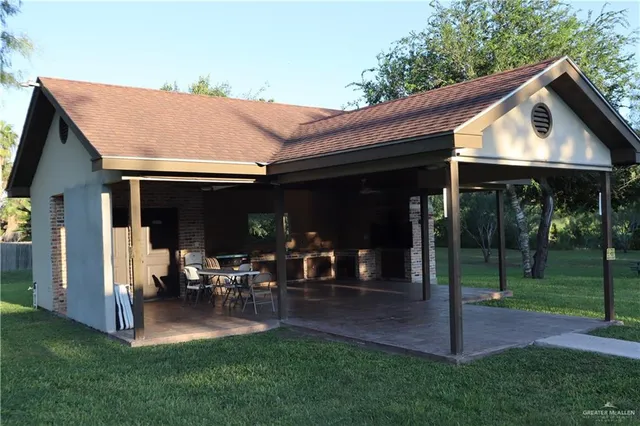 a dining room with furniture and a floor to ceiling window