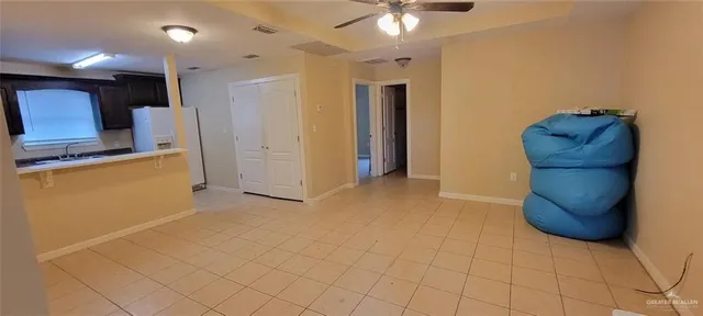 a kitchen with stainless steel appliances granite countertop a refrigerator and a stove