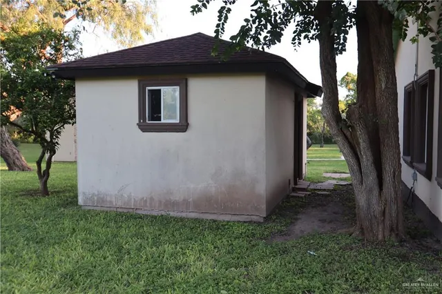 a backyard of a house with lots of green space