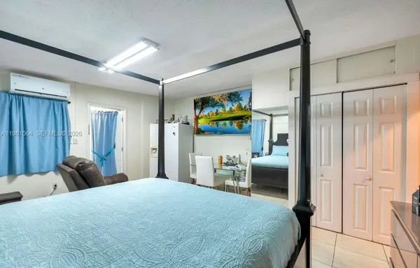 a bedroom with a bed and a walk in closet