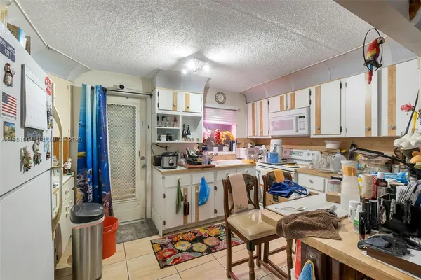 a view of a kitchen with furniture and a window