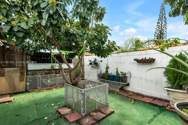 a view of a garden with patio