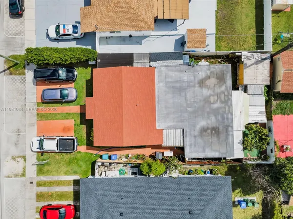 an aerial view of a houses with outdoor space and street view