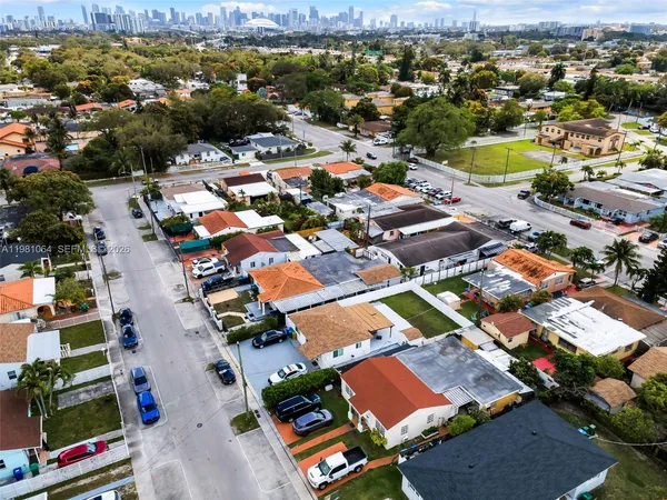 an aerial view of residential houses with outdoor space