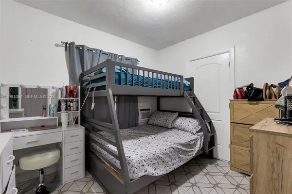 a bedroom with a bed and cabinets
