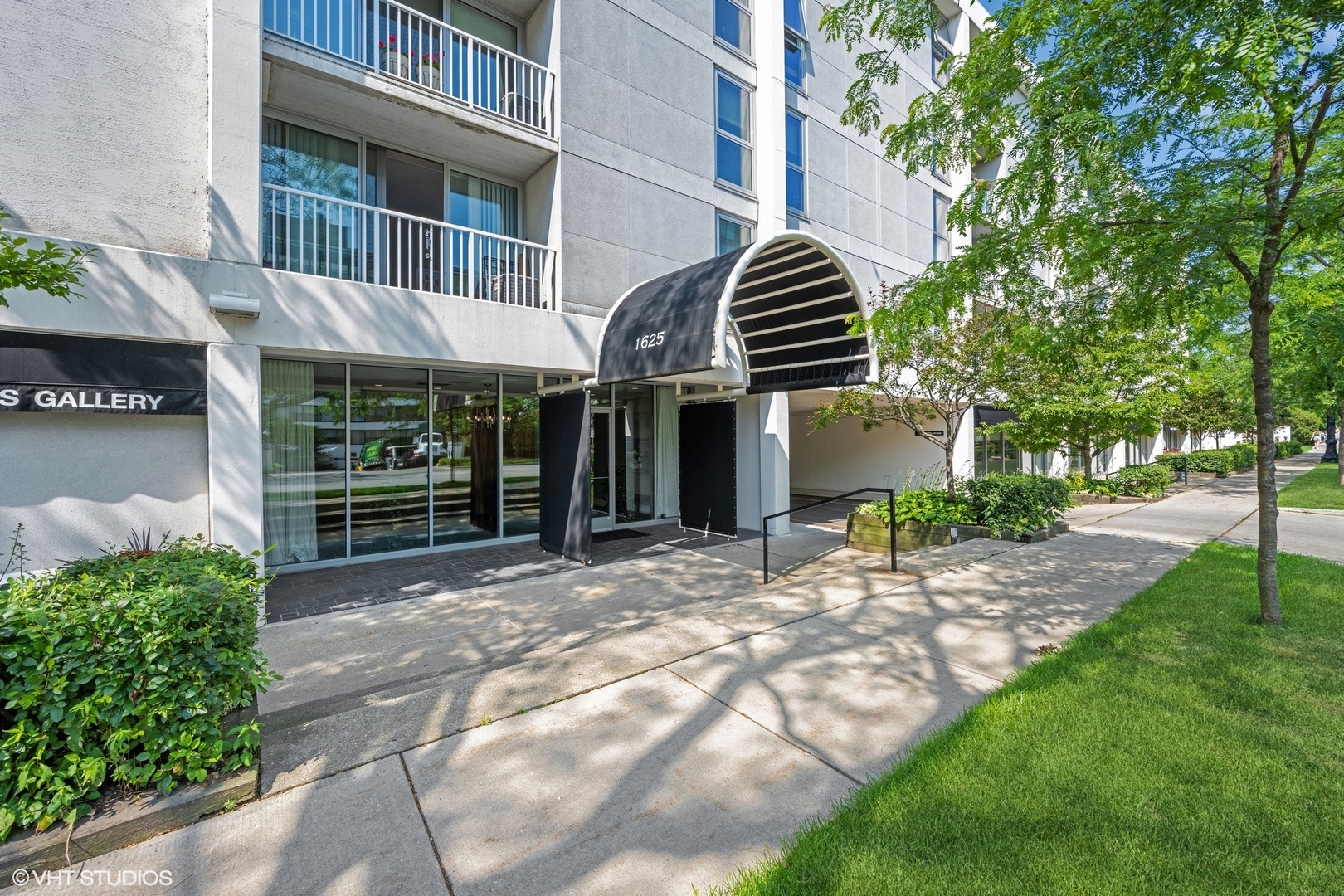 1625 Sheridan Road, Unit 406 Wilmette, IL 60091 - Photo 1 of 10 a view of a house with a yard and sitting area
