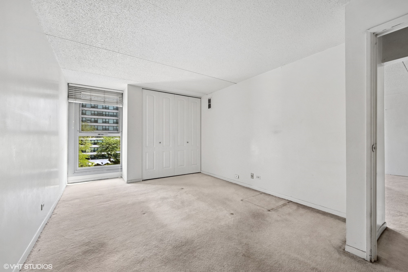 1625 Sheridan Road, Unit 406 Wilmette, IL 60091 - Photo 6 of 10 a view of an empty room with a window