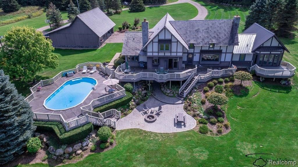 3850 West Oregon Road Lapeer, MI 48446 - Photo 5 of 94 Birdseye view of rear. Hardscape with multiple beds, decks and pool.