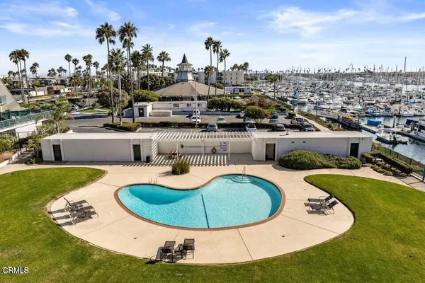 a view of a swimming pool with a yard