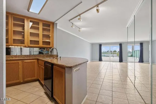 a kitchen with a sink and a window