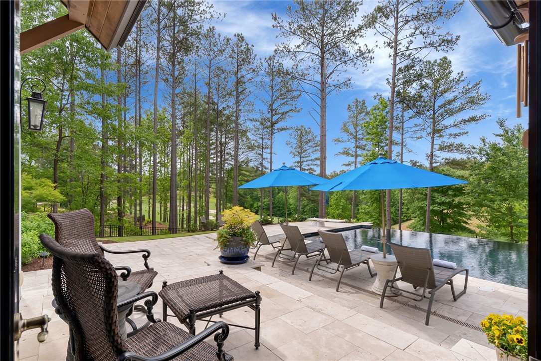 119 Drewberry Lane Sunset, SC 29685 - Photo 23 of 42 Relax poolside on this expansive patio, offering serene views of the golf course.