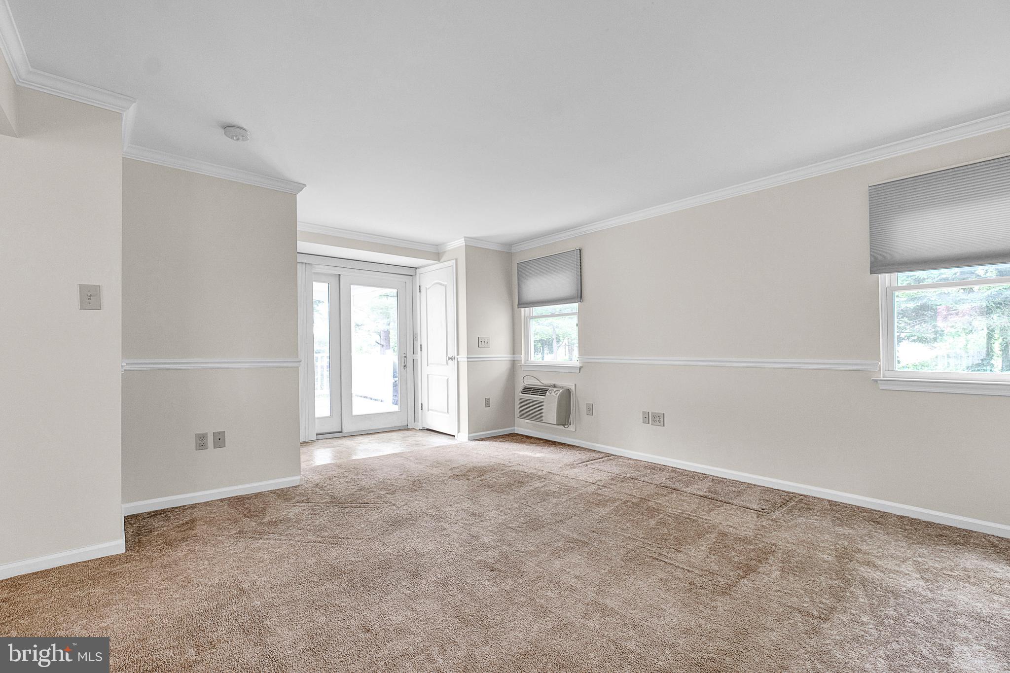 1225 Bruce Road Oreland, PA 19075 - Photo 14 of 35 Family room facing access to covered rear porch.