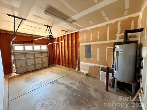 a view of a garage with wooden fence