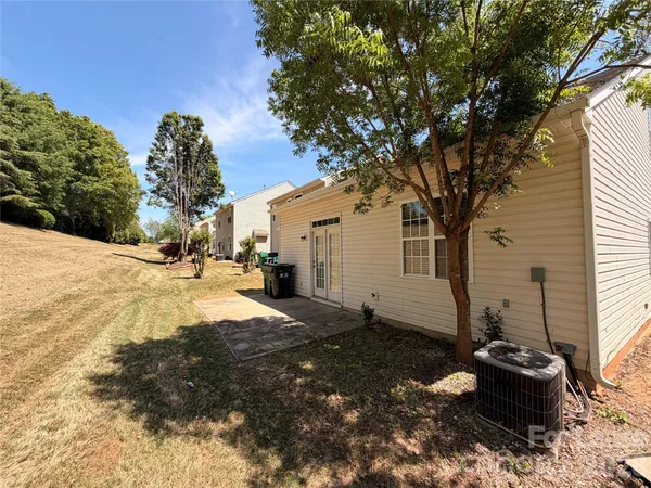 a view of a backyard with a large tree