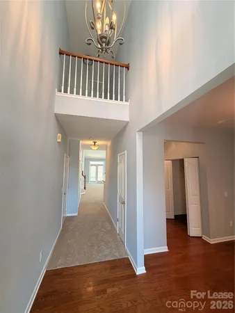 a view of a hallway view with staircase