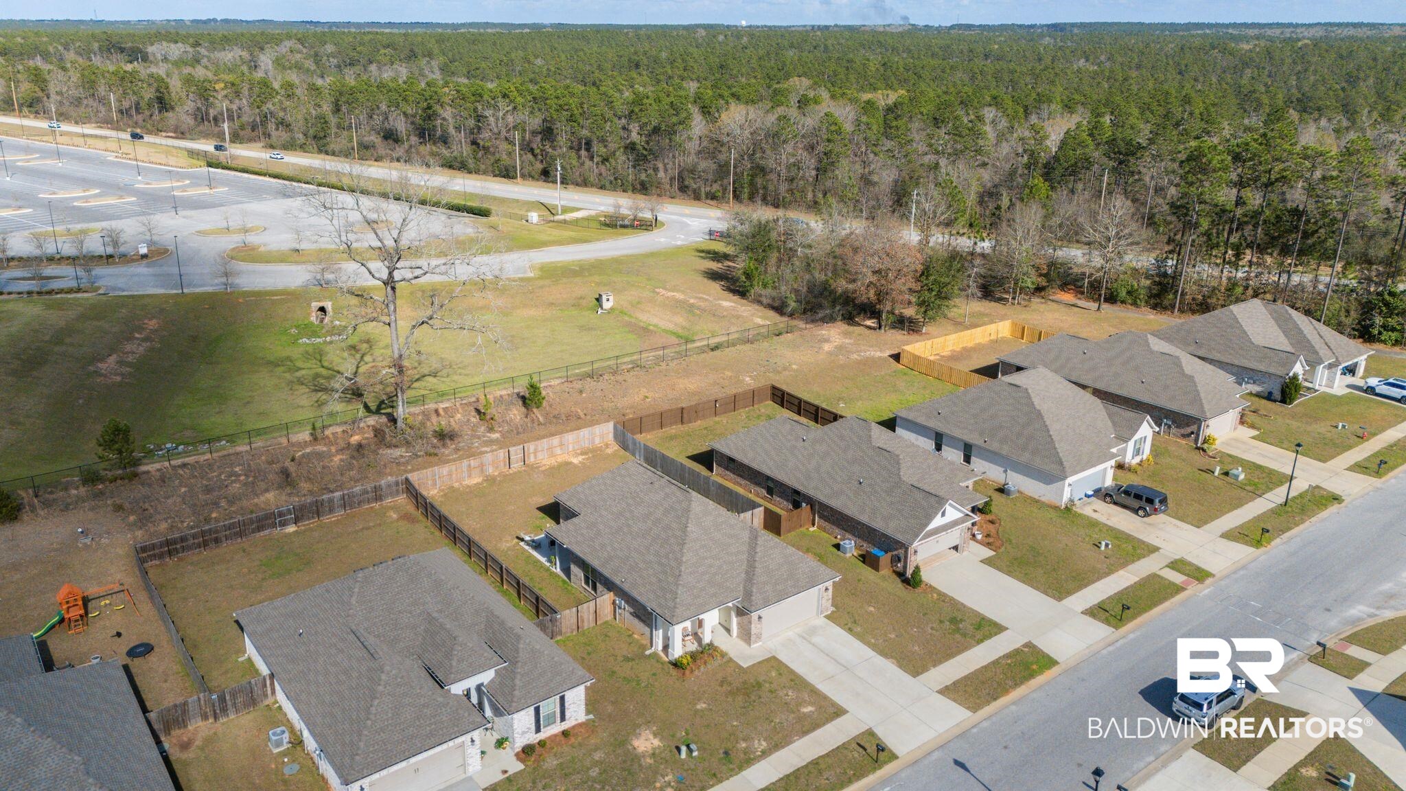 10745 Brodick Loop Daphne, AL 36527 - Photo 35 of 39 Aerial perspective of suburban area featuring a forest