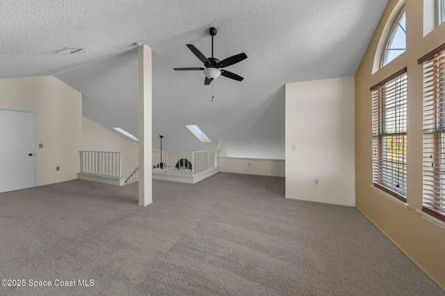 a view of a livingroom with a staircase