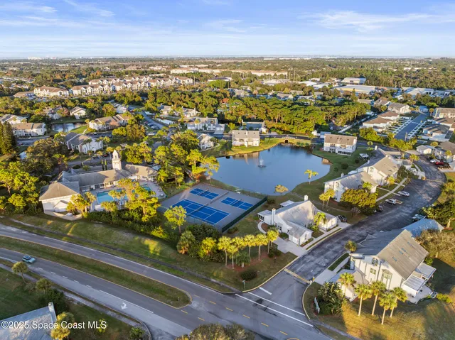 an aerial view of residential houses with outdoor space