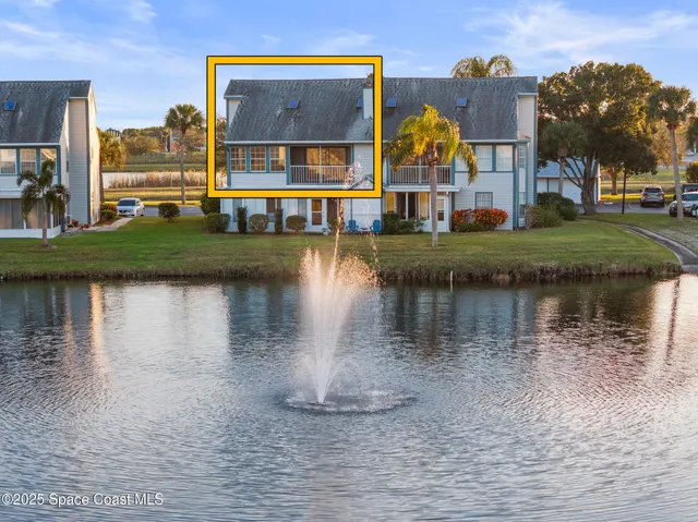 an aerial view of a city with lawn chairs