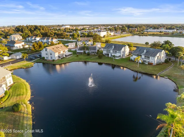 a view of a street that has couple of cars parked on the road