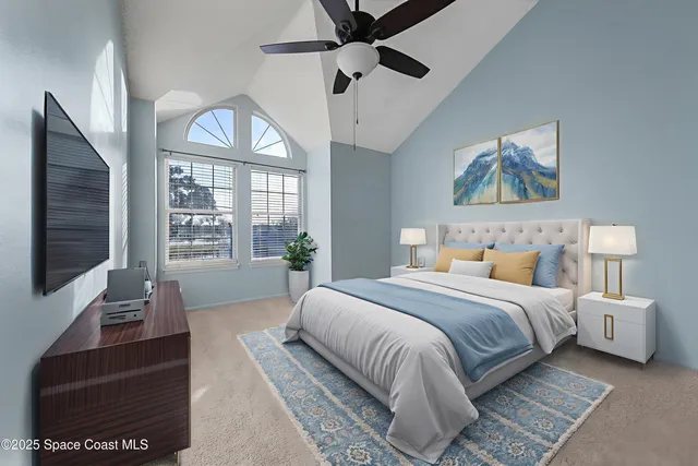 a living room with furniture a flat screen tv and a window