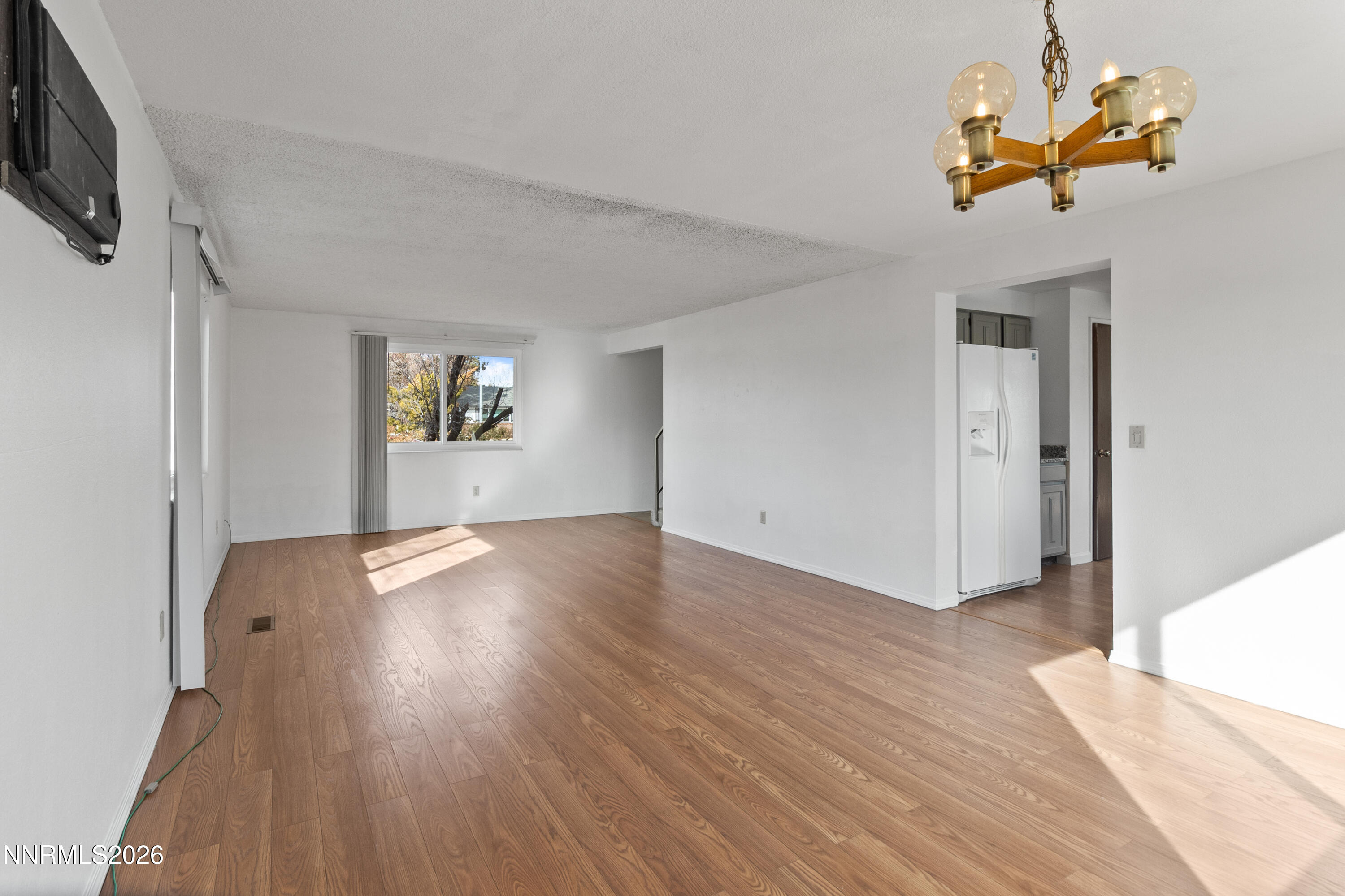 3142 Jarbidge Way Sparks, NV 89434 - Photo 12 of 42 a view of empty room with wooden floor and fan