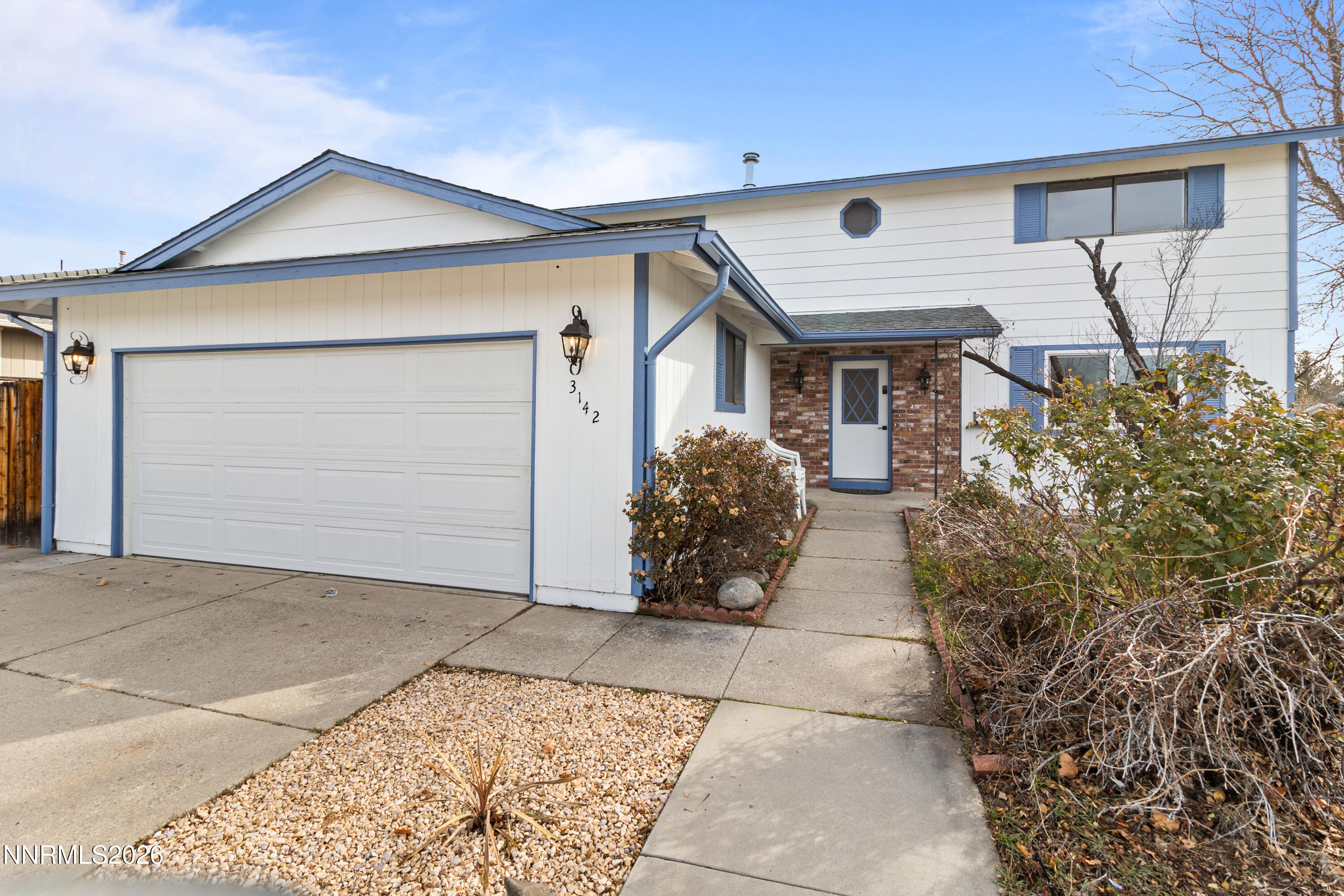 3142 Jarbidge Way Sparks, NV 89434 - Photo 2 of 42 a front view of a house with garden
