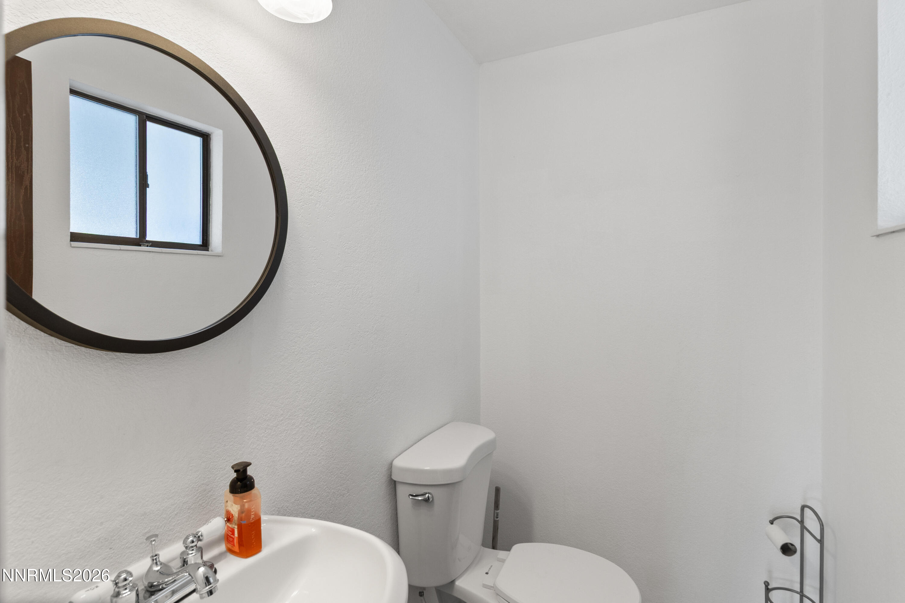 3142 Jarbidge Way Sparks, NV 89434 - Photo 23 of 42 a bathroom with a toilet a sink and mirror