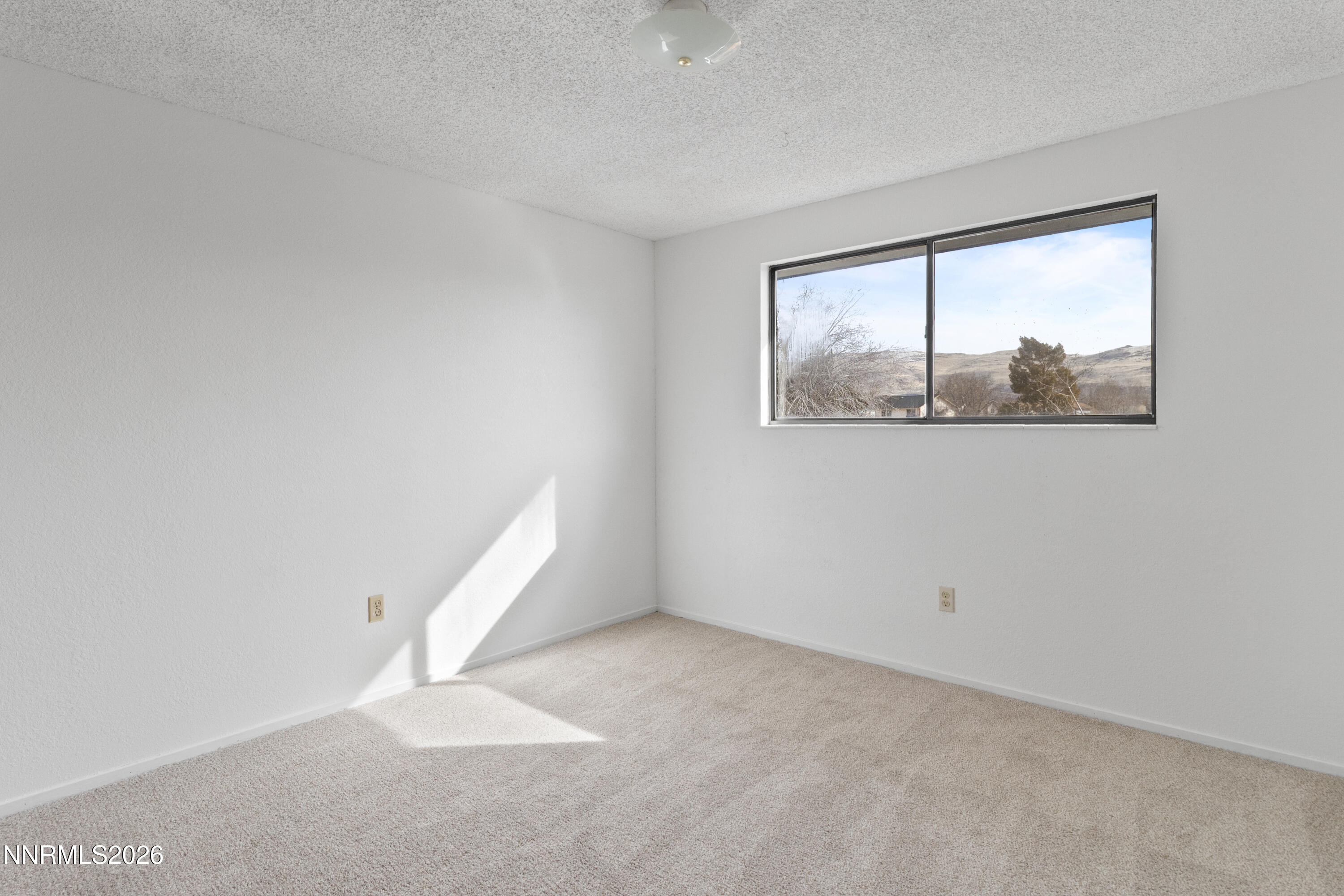 3142 Jarbidge Way Sparks, NV 89434 - Photo 28 of 42 an empty room with a window